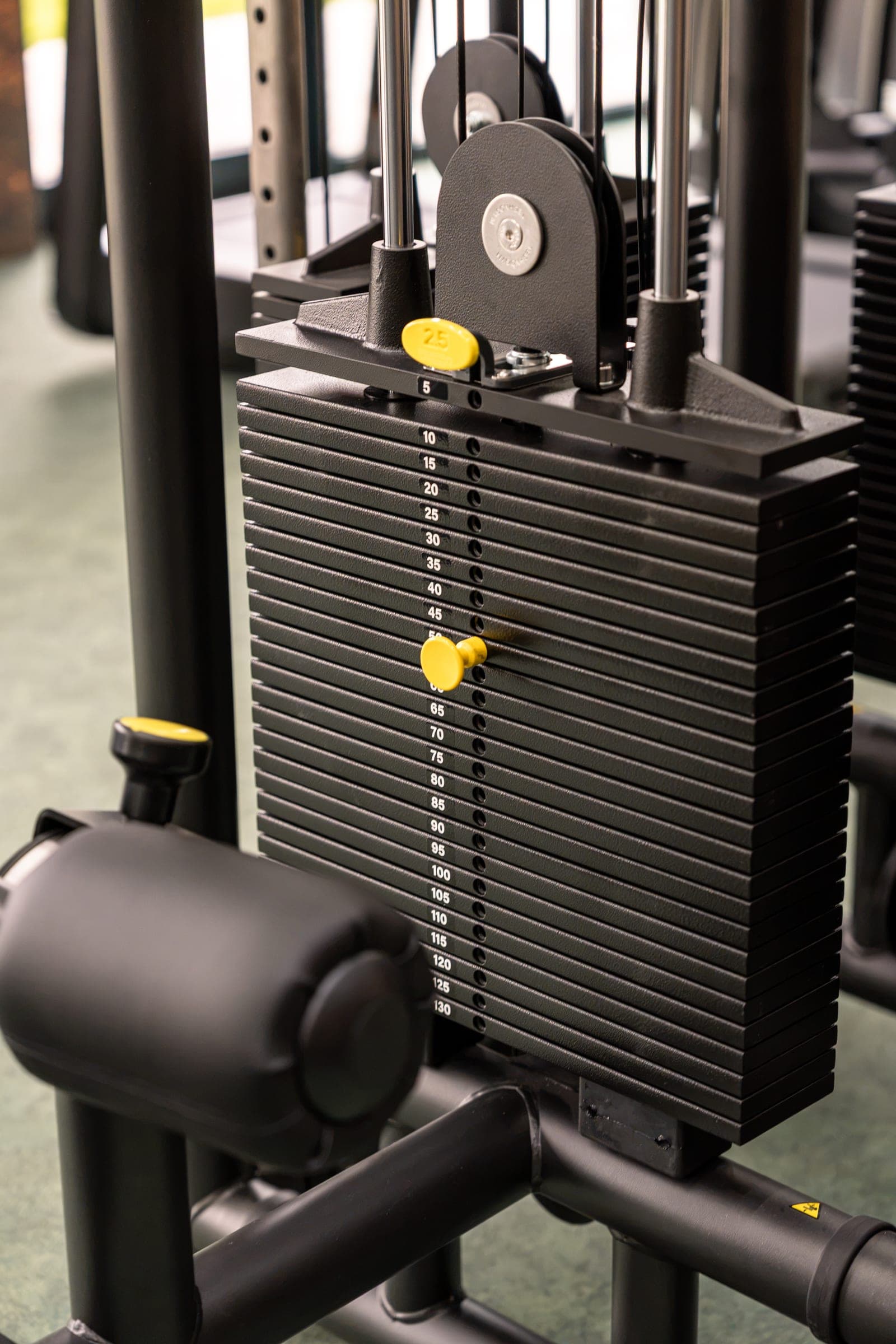 Weight stack of a strength machine in the MONA&CO gym in Žamberk